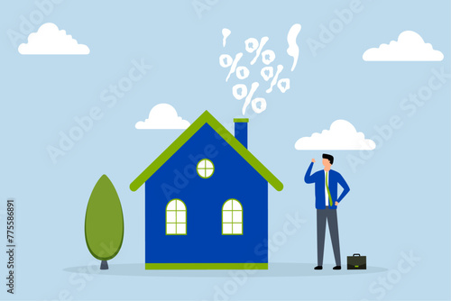 Real estate and housing mortgage rates, businessman home owner looks at  smoke rising from fireplace of  house