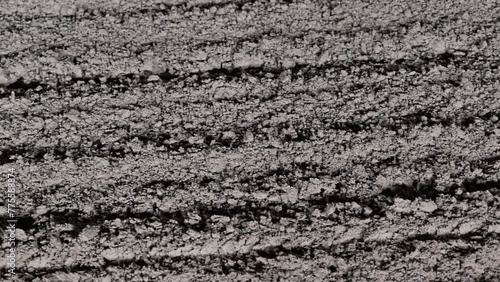 A closeup of the soil at the dirt race track, commonly utilised for horse racing events worldwide photo