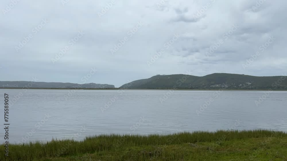 Knysna heads from the lagoon water's edge on a overcast day Knysna heads from the lagoon water's edge on a overcast day