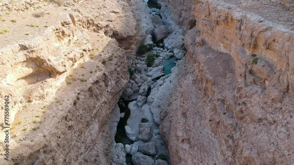 Aerial of amazing Wadi Tiwi oasis with turquoise water and canyon in the Sultanate of Oman. Aerial of amazing Wadi Tiwi oasis with turquoise water and canyon in the Sultanate of Oman.