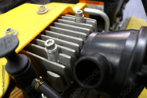 Photo of a tractor engine being repaired in a workshop