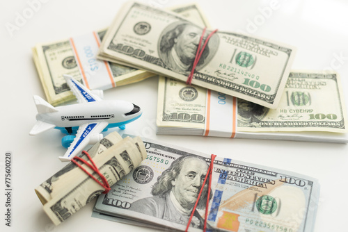 white plane on dollar cash closeup