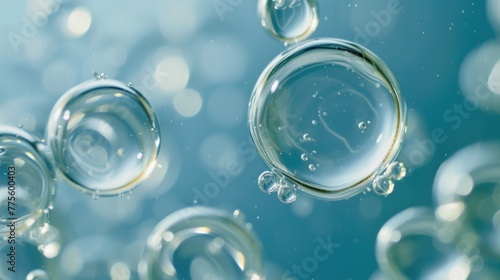 Close-up of transparent bubbles with blue tint. Macro shot with bokeh.