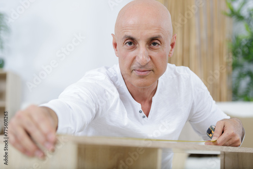 confident man during furniture installation