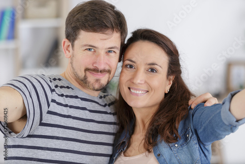 happy middle-aged couple taking selfie photo