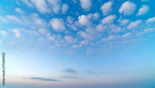 Sky scene with scattered white clouds