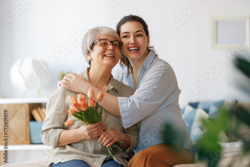 woman and her mother with flowers tulips