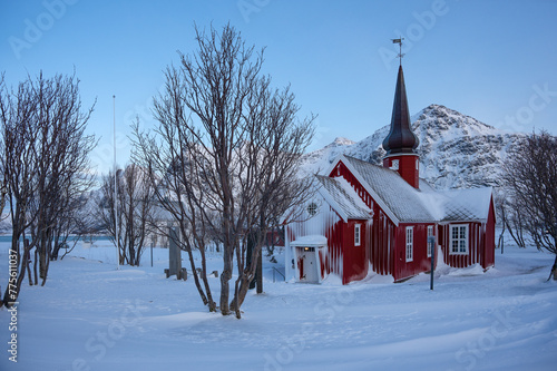 The parish church in Flakstad in winter covered with snow, a red wooden chapel from 1870, near Ramberg Lofoten, Norway