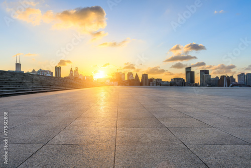 Empty square floor and city skyline with modern buildings scenery at sunset in Shanghai