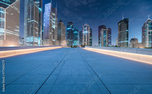 City square floor and modern commercial building scenery at night in Shanghai. Famous financial district buildings in Shanghai.