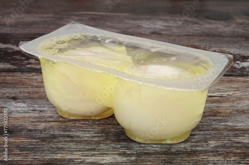 Pre cooked microwavable poached eggs pack containing two microwave poached eggs in brine