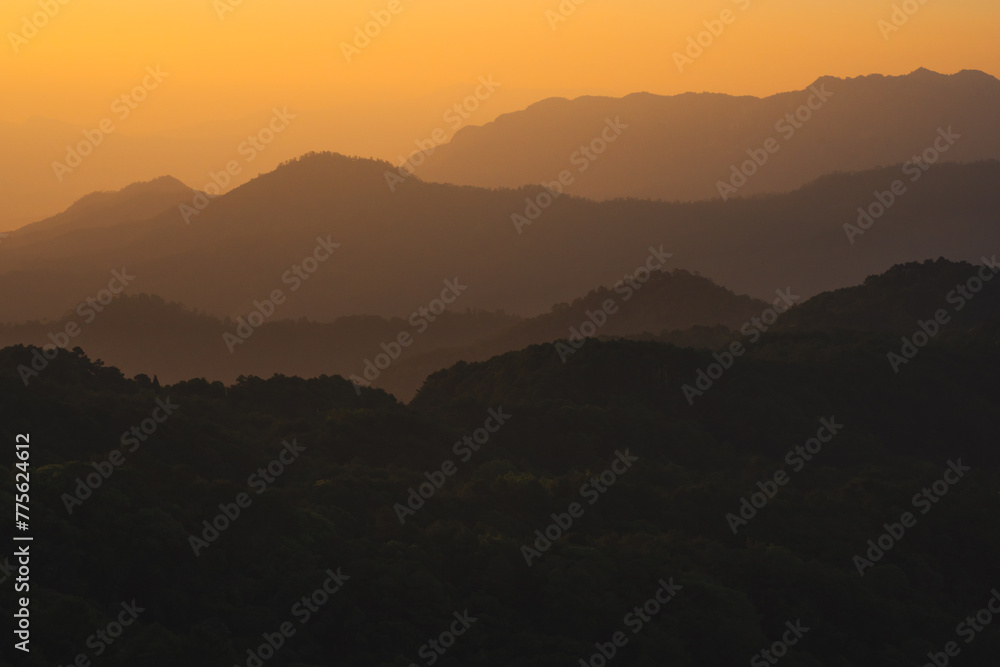 nature traveling with orange sky and layer of mountain with sunrise background nature traveling with orange sky and layer of mountain with sunrise background