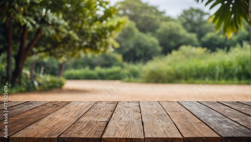 empty wooden table with blurred summer background