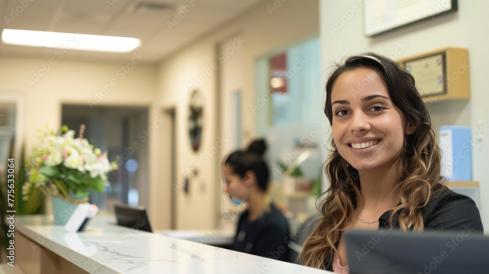 Obraz premium Smiling reception behind front desk