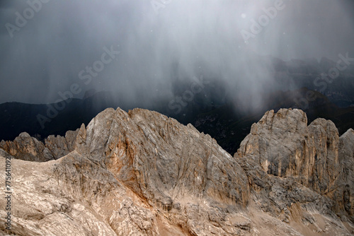The view of Sassolungo and the Sella Group from Serauta in stormy weather in the Dolomites, Italy. © erika8213