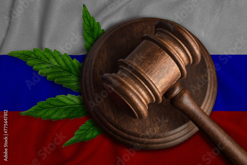 Judges gavel and cannabis leaf on the flag of Russia. The concept of legalization of marijuana in Russia.