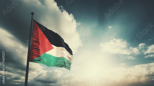 Palestine flag waving in the wind at cloudy sky © MOUISITON