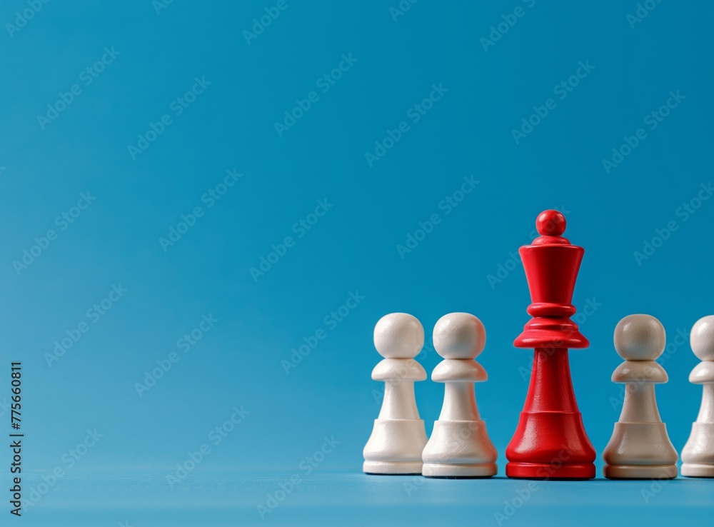 Red chess queen among white pawns on blue copy space