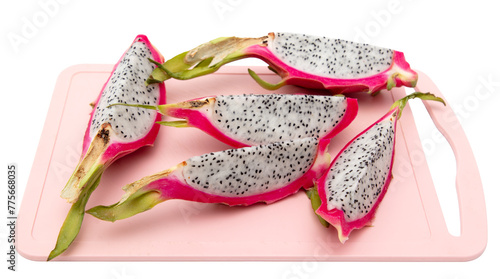 Dragon fruit on pink board isolated white background © schankz