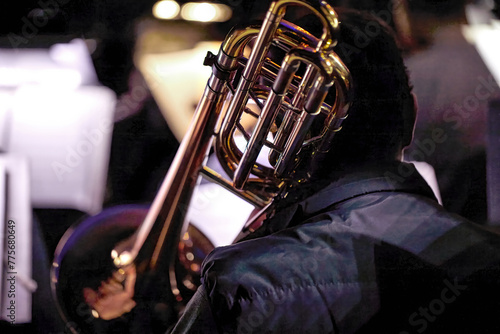  symphony orchestra musician playing the trombone.
