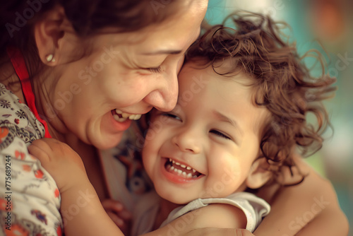 A joyful moment captured as a happy mother and her little son share laughter together, radiating warmth and love, ideal for family-themed concepts