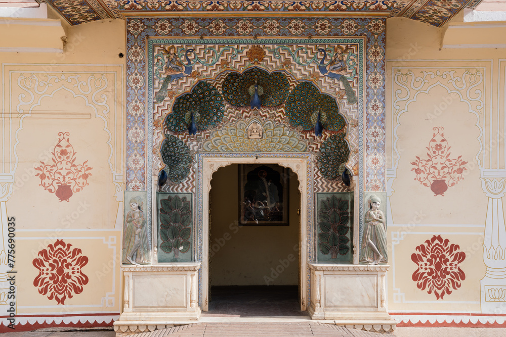 The Peacock gate with motifs of peacocks on the autumn doorway, dedicated to Lord Vishnu at City Palace in Jaipur, India The Peacock gate with motifs of peacocks on the autumn doorway, dedicated to Lord Vishnu at City Palace in Jaipur, India