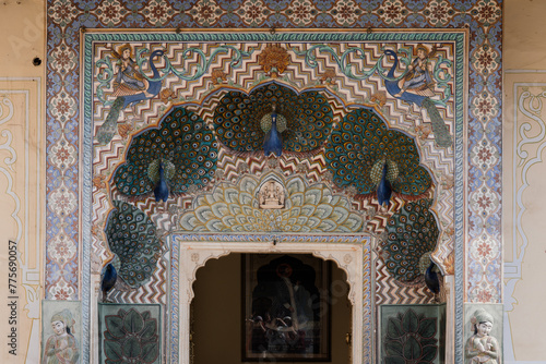 The Peacock gate with motifs of peacocks on the autumn doorway, dedicated to Lord Vishnu at City Palace in Jaipur, India photo