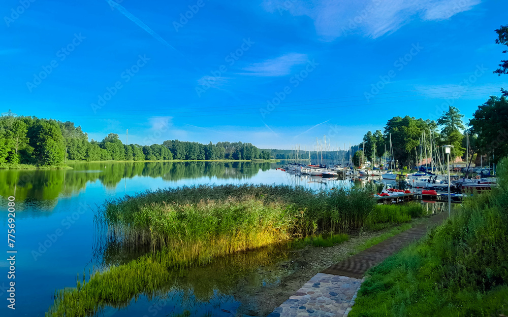 View of Lake Wdzydze and the marina in the distance. Sailing on Lake Wdzydze, one of the largest lakes in Poland.