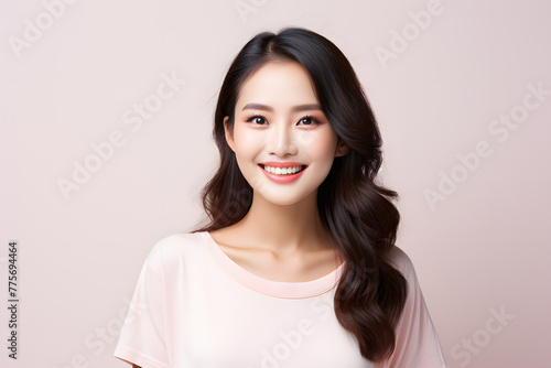 Closeup portrait of Beautiful smiling Asian woman with smooth healthy skin © Oksana