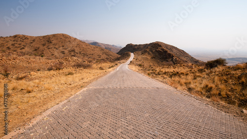 Road crossing the Namibian hills towards the Namib-Naukluft National Park.