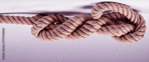 The rope knot is isolated on a white background as a strong nautical line tied together as a symbol of trust and faith and a metaphor for strength or bright colourful illustration