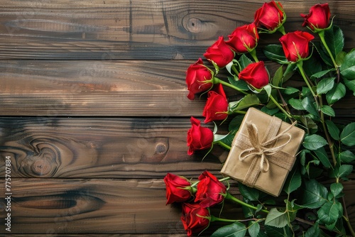 Mother day background or Valentines Day, wedding day. Beautiful blooming Red roses and present on wooden board. Top view flat lay background. Copy space