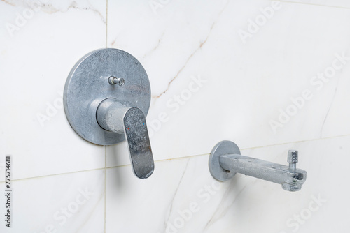 dirty shower tap, concealed faucet with limescale deposits