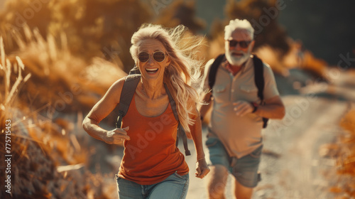 A couple of old people, man and woman woman joyfully jogs. Healthy retirement lifestyle. 