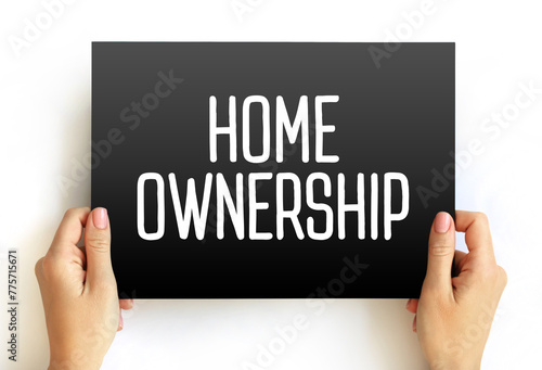 Home Ownership - the fact of owning your own home, text concept on card photo