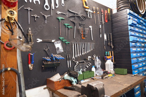 Stand with work tools in professional bicycle workshop. High quality photo