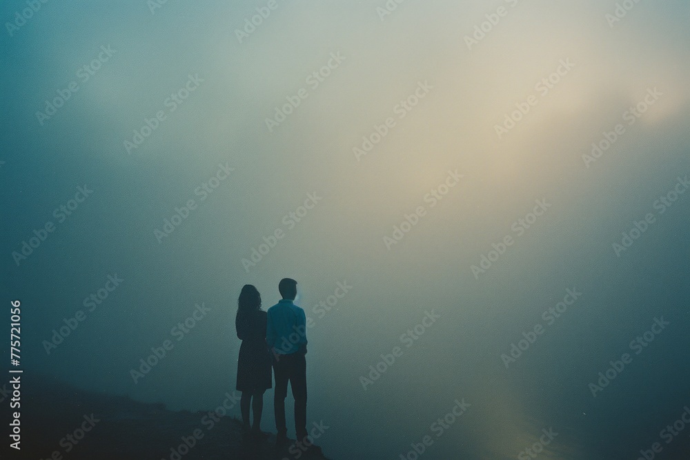 Couple standing by each other in the fog, romantic dark natural scene Couple standing by each other in the fog, romantic dark natural scene