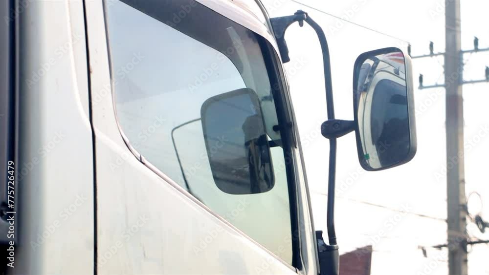 The cabin of truck slowly riding in a convoy on the highway. The cabin of truck slowly riding in a convoy on the highway.