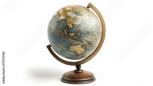 Vintage world globe on stand against a white background.