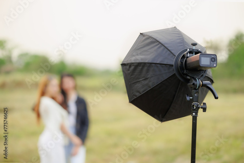 portable flash light setup with reflector modifier for portrait lighting outdoor photography photo