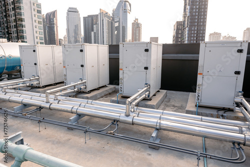 Photography Heat pump Compressor hot water supply by heat exhanger to heating water for hotel or large commercial building roof top outdoor installation