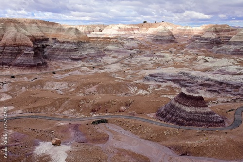looking down on the blue mesa trail and petrified wood  in  the colorful blue mesa  badlands area of petrified forest national park, arizona, on a stormy winter day