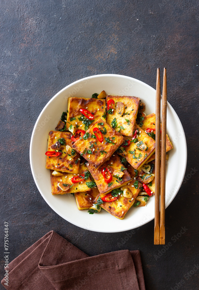 Fried tofu with peppers, garlic and herbs. Vegetarian food. Healthy eating. Diet. Fried tofu with peppers, garlic and herbs. Vegetarian food. Healthy eating. Diet.