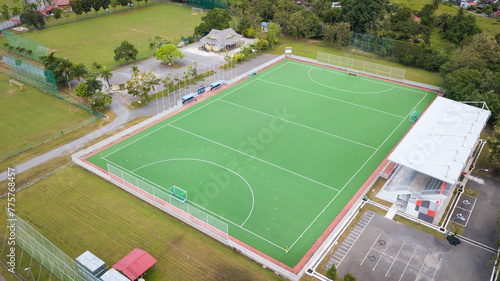 Aerial view of an artificial grass field hockey pitch. The sports center is empty and there is no one there.
