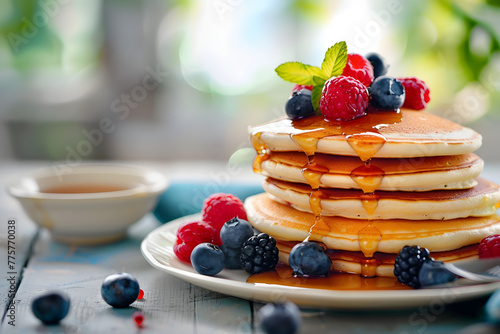 Freshly Stacked Pancakes with Maple Syrup and Mixed Berries on Rustic Table, Delicious Breakfast Concept