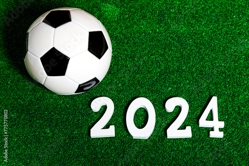 A soccer ball next to a 2024 number