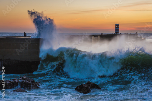 Spectacular waves seen from Atlantic Ocean breakwater in Foz do Douro area during evening in Porto, Portugal
