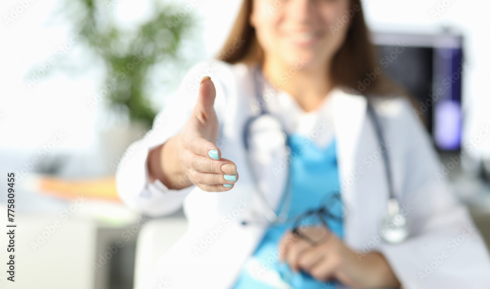 Close-up of smiling doctor welcome new patient and invite to sit. Appointment at clinic. Planned diagnostic and checkup. Modern medicine and equipment for analysis concept Close-up of smiling doctor welcome new patient and invite to sit. Appointment at clinic. Planned diagnostic and checkup. Modern medicine and equipment for analysis concept