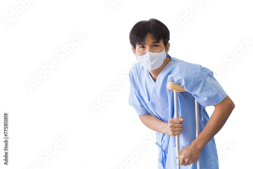  Asian male patient person in blue hospital gown holding onto crutchindi cative of injury or disability, capturing the essence of recovery or physical limitation while isolated white background. photo