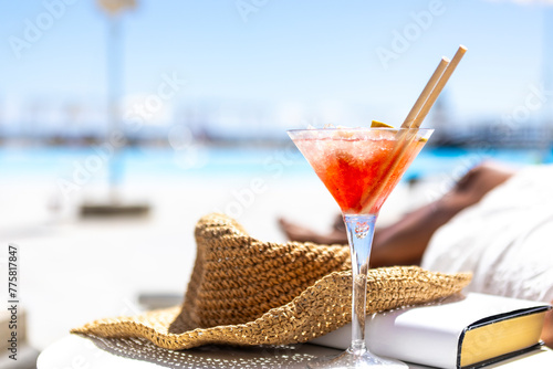 Relaxation and holidays concept with cocktail on tropical beach photo